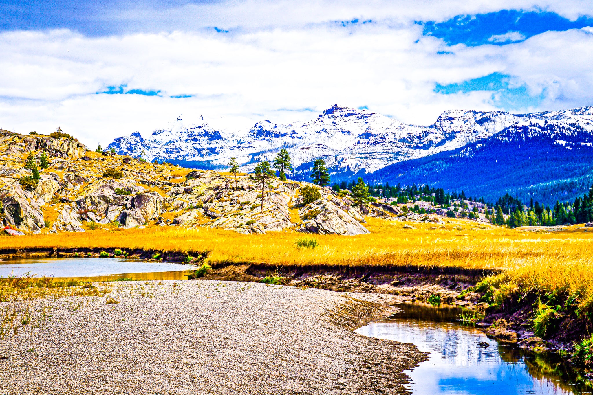 A river winds through this lush prairie-valley in northern Yellowstone.